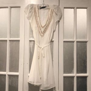 White dress with beige detail